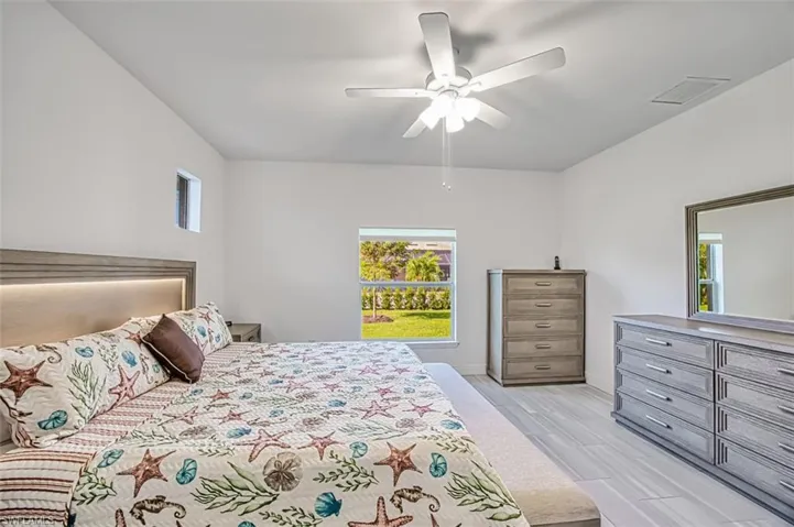 Bedroom featuring ceiling fan and wood finish floors