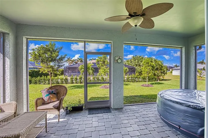 Sunroom / solarium with a ceiling fan