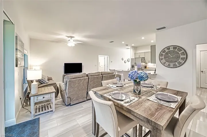 Dining area with ceiling fan, recessed lighting, and wood finish floors