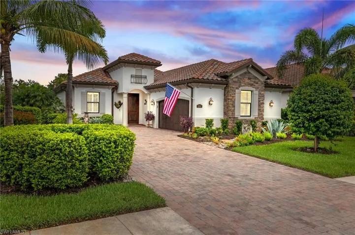 Mediterranean / spanish-style house featuring a garage