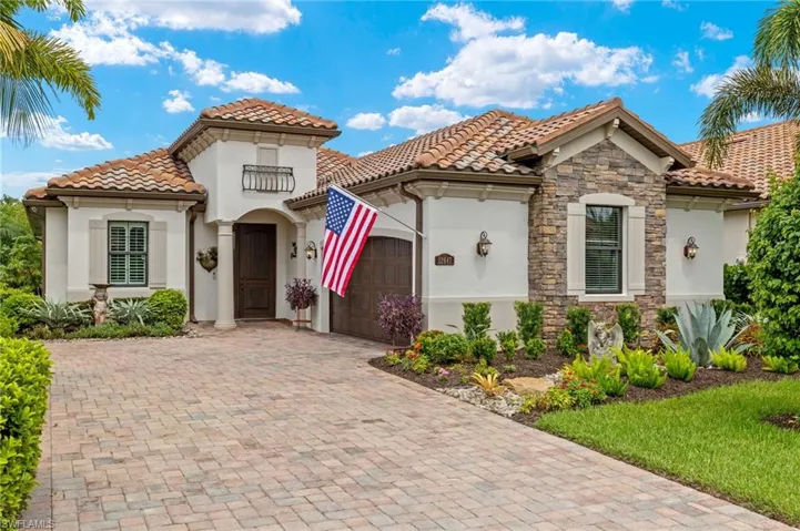 Mediterranean / spanish-style house with a garage