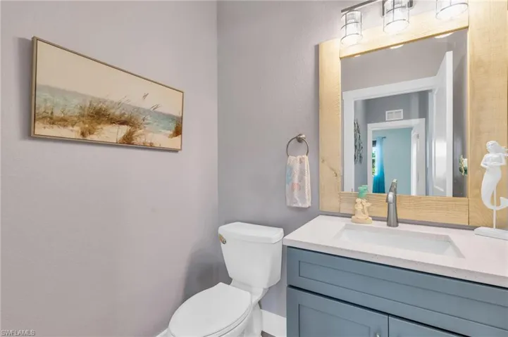 Bathroom featuring vanity and toilet