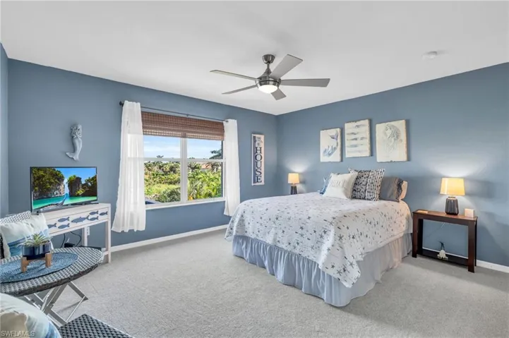 Bedroom featuring carpet floors and ceiling fan