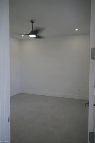 Unfurnished room featuring recessed lighting, light tile patterned flooring, and a ceiling fan