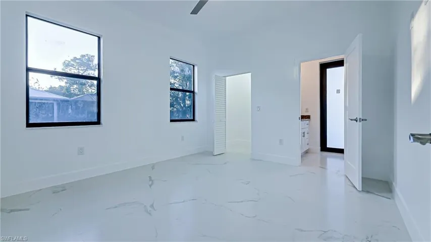 Unfurnished bedroom with baseboards and ceiling fan