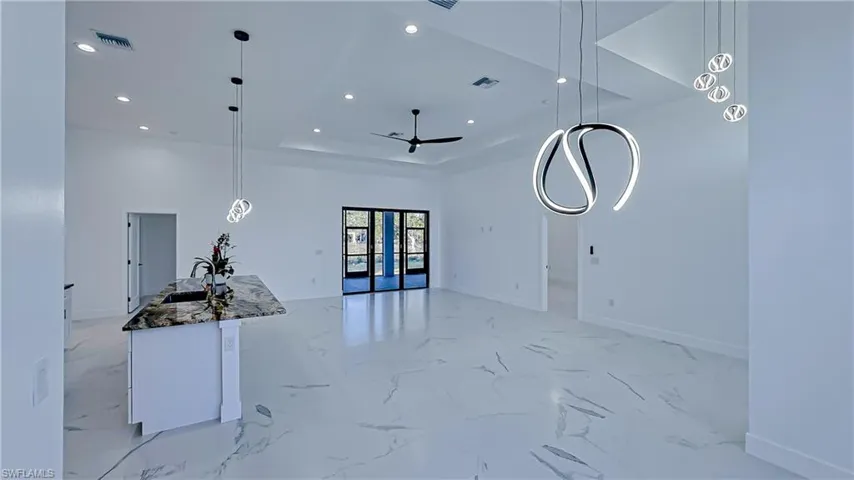 Unfurnished living room with recessed lighting and ceiling fan