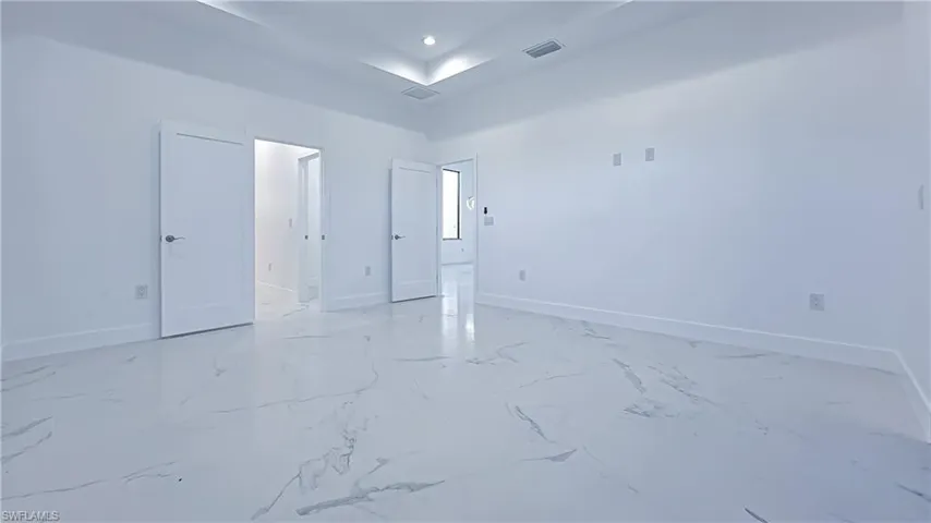 Unfurnished room featuring baseboards