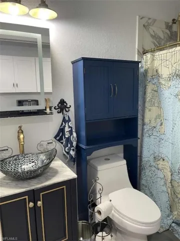 Full bath with vanity, a shower