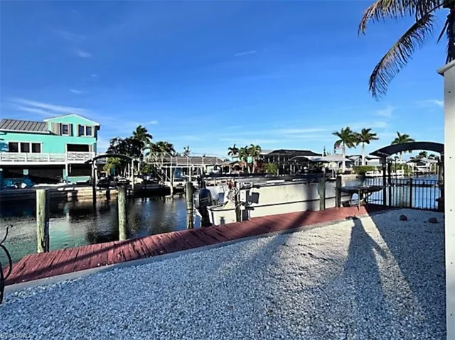 Dock with boat lift and a water view