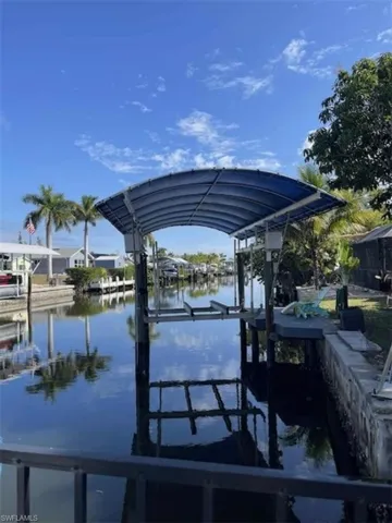 Dock area featuring a water view and boat lift