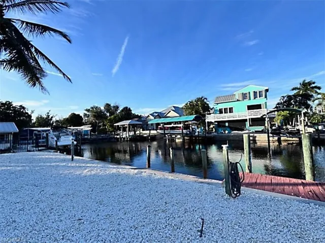 Dock area featuring a water view