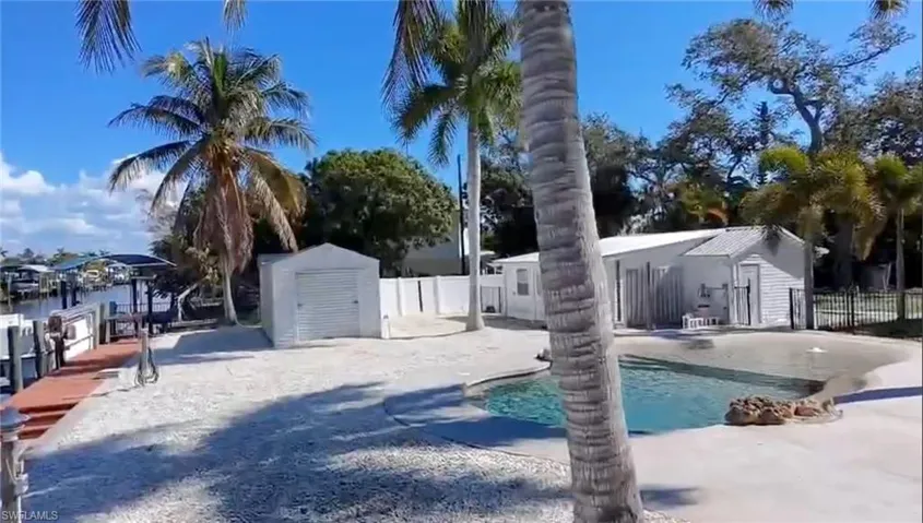View of pool featuring a shed