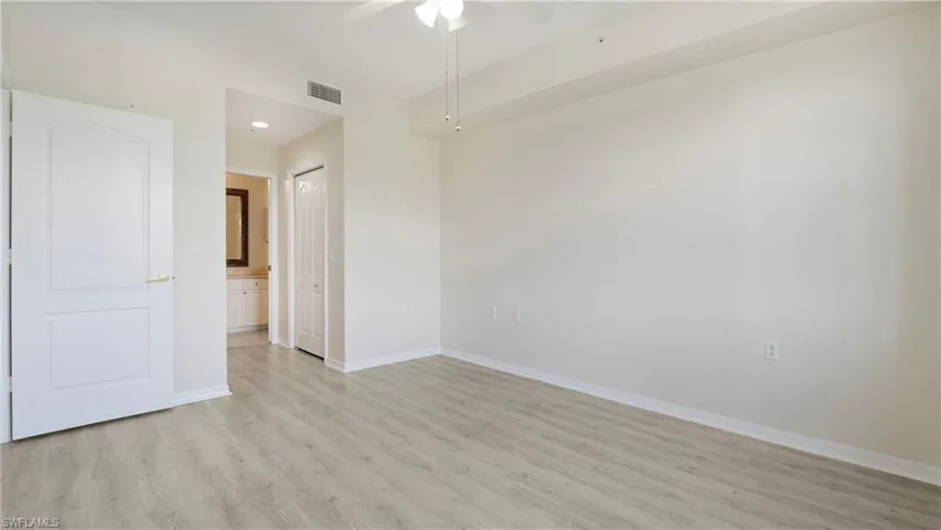 Spare room featuring light wood-style floors, ceiling fan, and recessed lighting