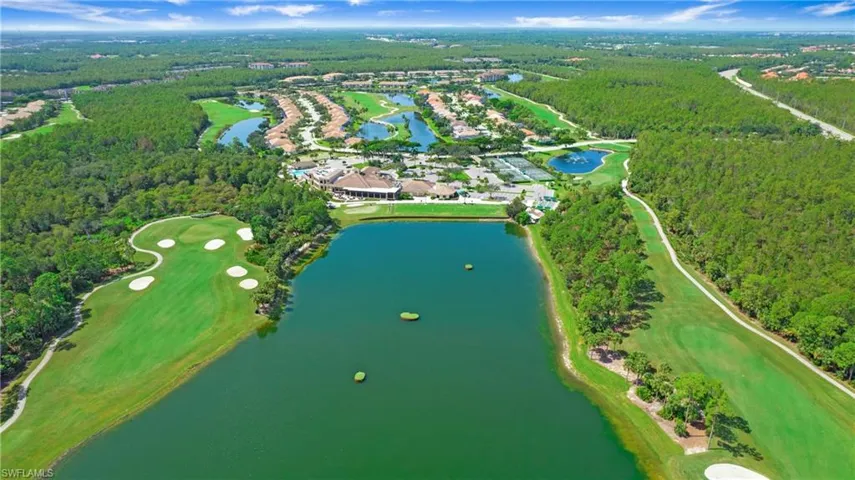 Aerial overview of property's location featuring a golf club and a large body of water