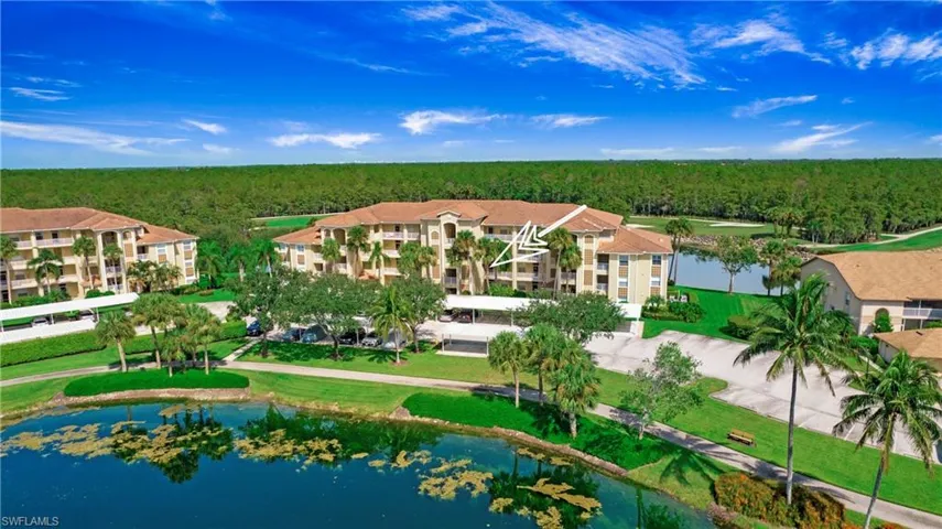 View of property location featuring a heavily wooded area and a nearby body of water