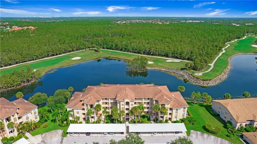 Aerial view of a golf course and a forest