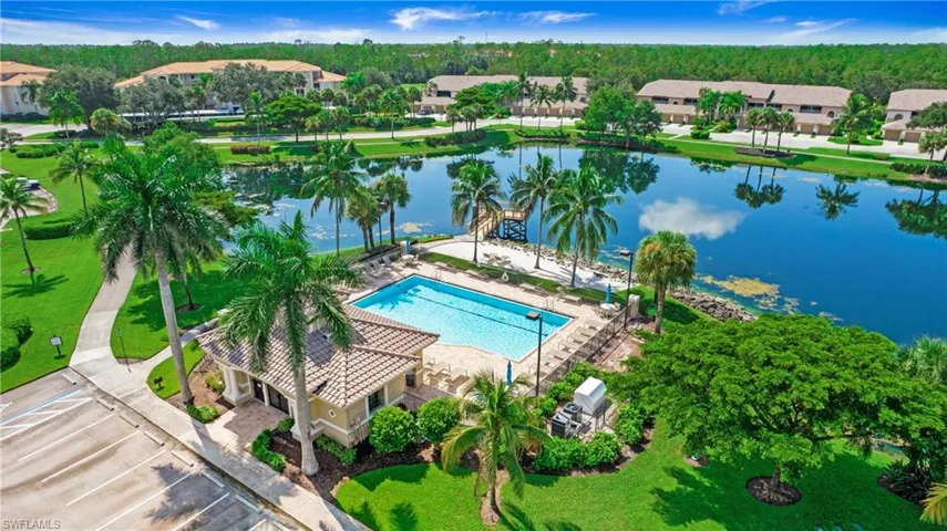Aerial view of a pool and a large body of water