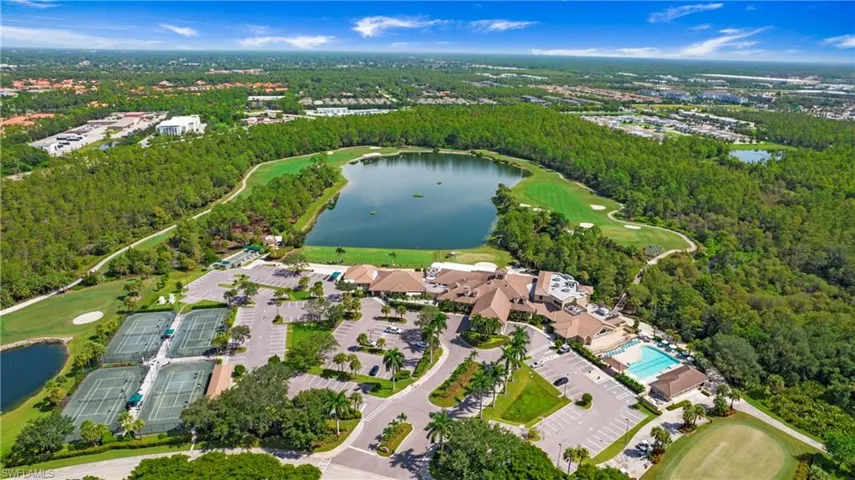 View of property location featuring a large body of water and a local golf course