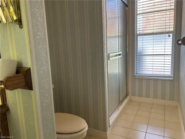 Primary suite bathroom step in shower.