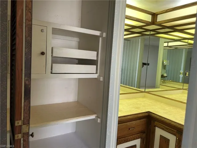 Primary suite bathroom featuring custom linen ect. closet.