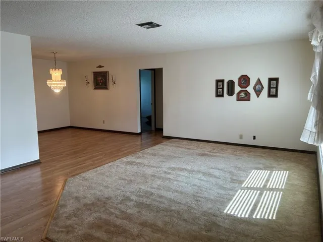 Living + dining rooms hardwood / wood-style flooring