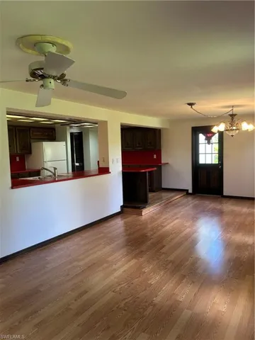 HUGE family room off kitchen, door to side yard.