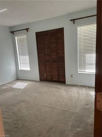 1st Large guest bedroom, reach in closet wooden mini blinds