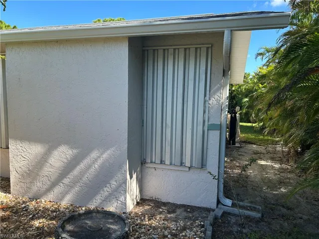 Right hand front of home guest room window before shutter removal.