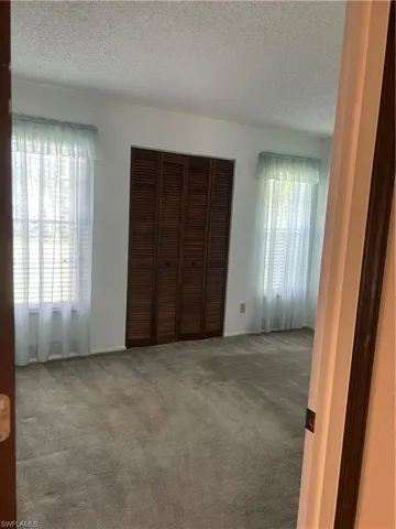 2nd Large guest bedroom, reach in closet, wooden mini blinds
