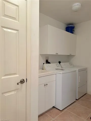 Large laundry room with sink.