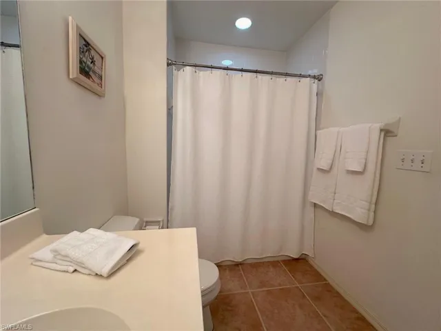 Guest bath has tub and shower with tile that goes to the ceiling in shower.  Perfect for cleaning!