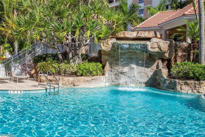 Regatta resort style pool with cascading waterfall. One of two pools available to residents at Regatta.