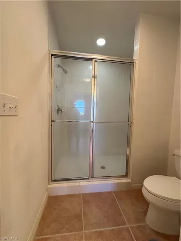 Shower and toilet in separate room.
