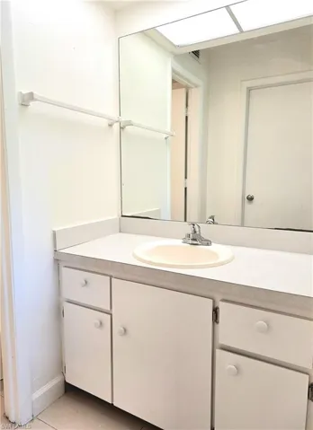 Bathroom featuring vanity and tile patterned flooring