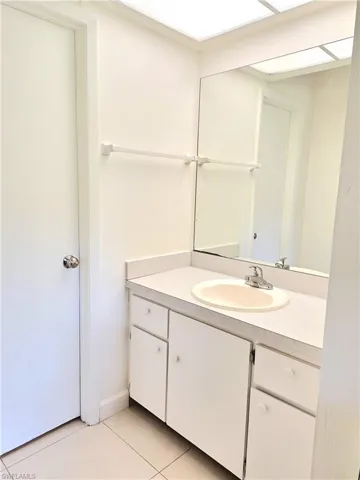 Bathroom featuring tile patterned floors and vanity