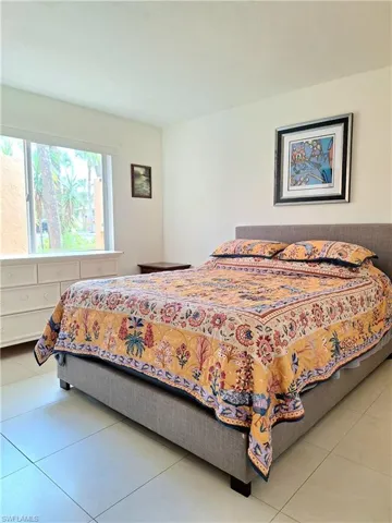 Bedroom 1 of 2 featuring light tile patterned floors