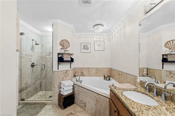 Primary Bathroom with Tile Shower and Soaking Tub