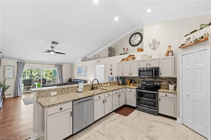 Kitchen with View of Lanai and Pool Area