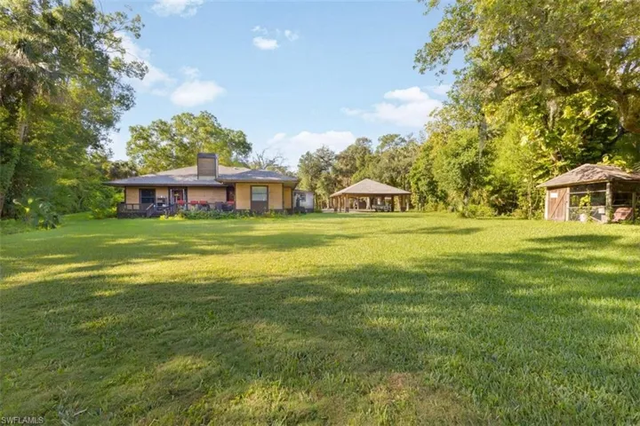 View of green lawn featuring a gazebo