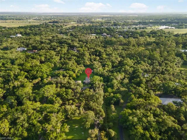 Aerial overview of property's location featuring a forest