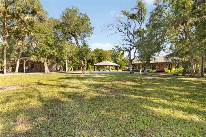 View of green lawn featuring a gazebo