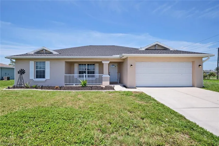 Single story home with a front yard, a garage, and central air condition unit
