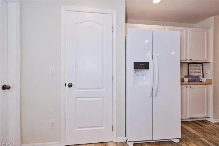 Kitchen with white cabinetry.