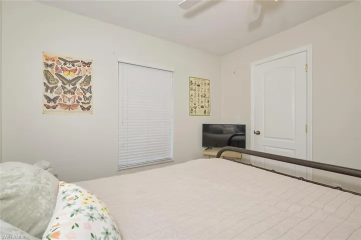 Bedroom featuring ceiling fan and a closet