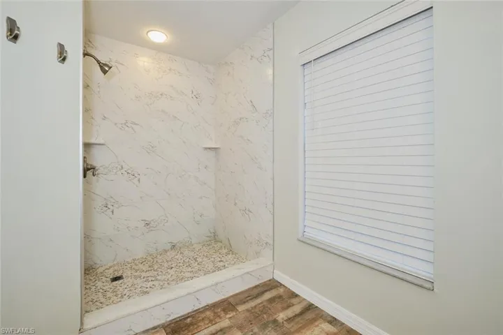 Bathroom featuring a tile shower