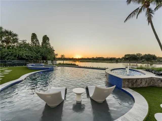 View of pool featuring a pool with connected hot tub and a patio