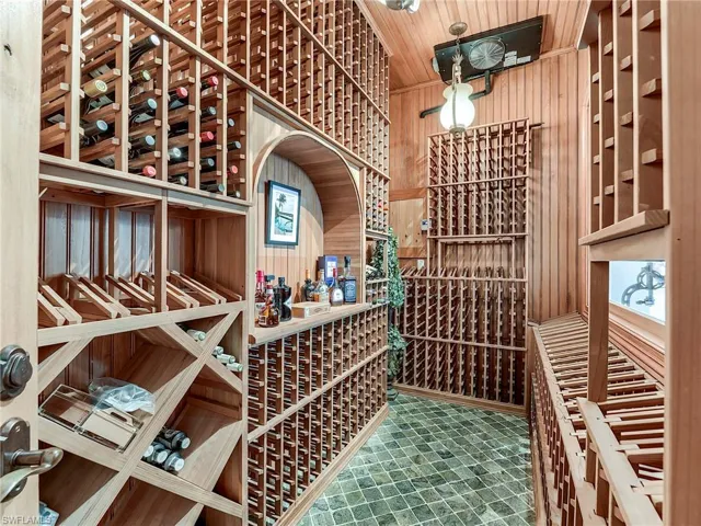 Wine room with wooden walls and wood ceiling