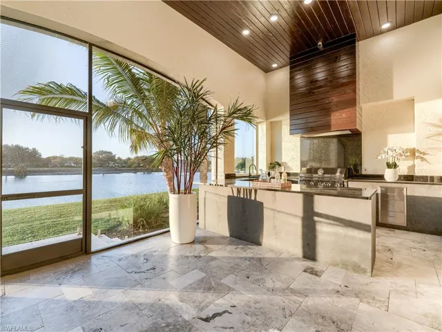 View of patio / terrace featuring area for grilling and a water view