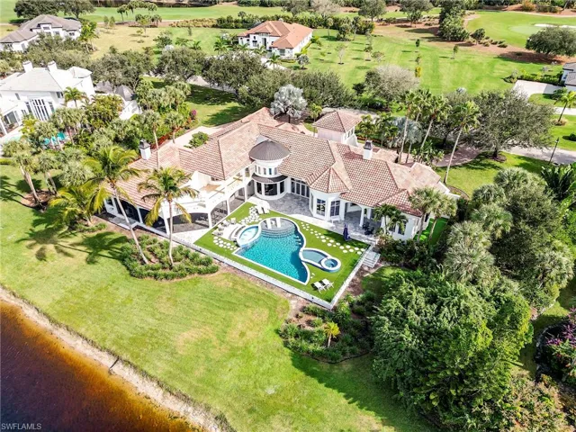 Bird's eye view of a pool area and a local golf course