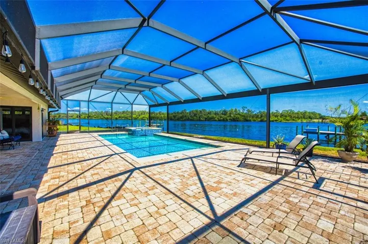 Enjoy lounging in the pool or spa overlooking the river.